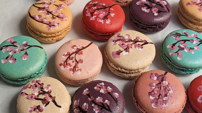 macarons painted with cherry blossoms