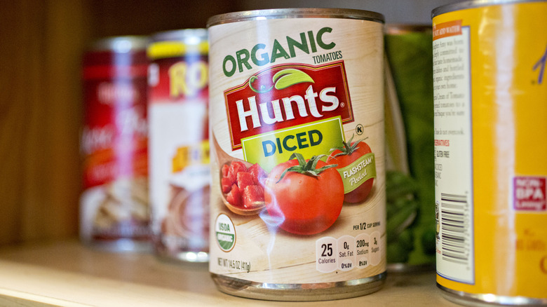 A can of Hunt's diced tomatoes in a pantry