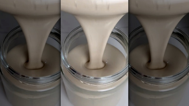 Whipped maple syrup pouring into jar