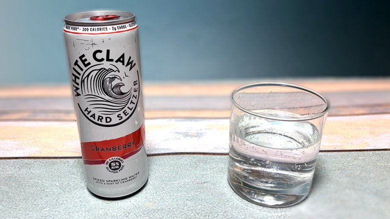 can and glass of white claw hard seltzer