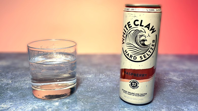 can and glass of white claw hard seltzer