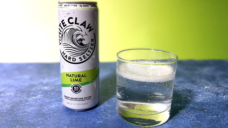 can and glass of white claw hard seltzer