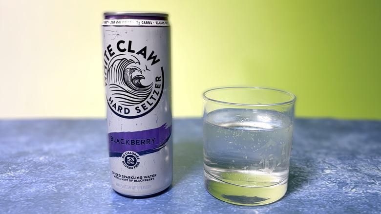 can and glass of white claw hard seltzer