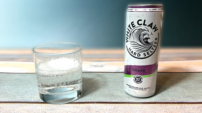 can and glass of white claw hard seltzer