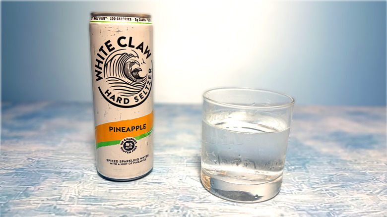 can and glass of white claw hard seltzer