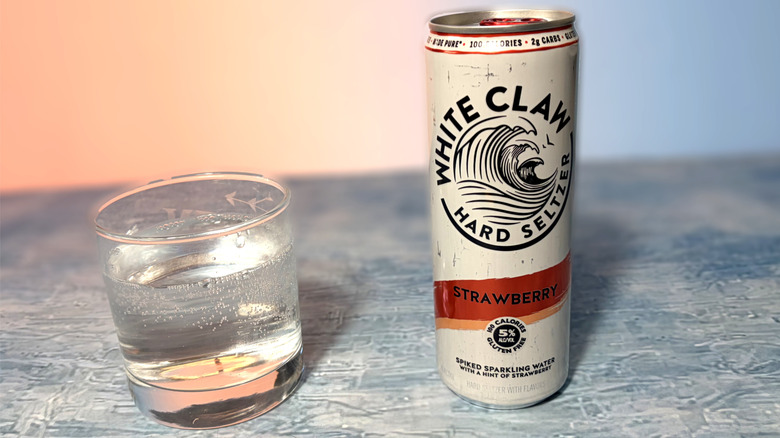 can and glass of white claw hard seltzer