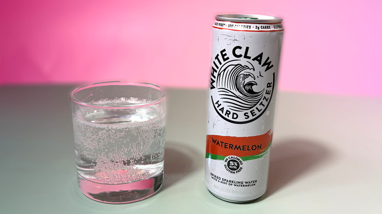 can and glass of white claw hard seltzer