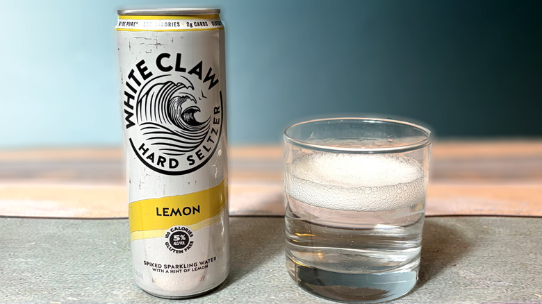 can and glass of white claw hard seltzer