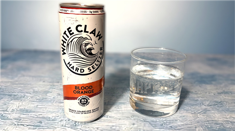 can and glass of white claw hard seltzer