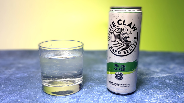 can and glass of white claw hard seltzer
