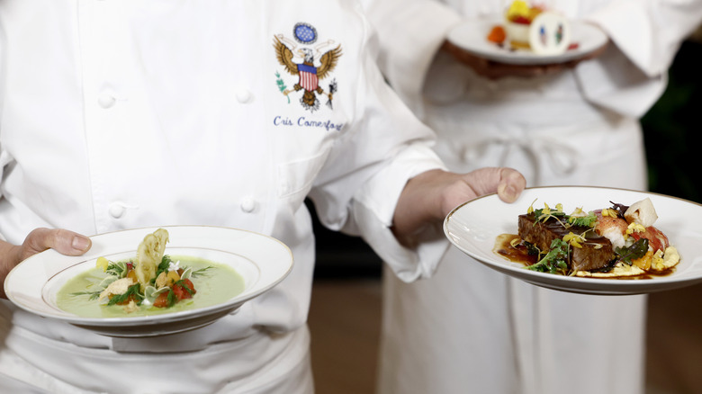 Close-up of Comerford holding prepared dishes