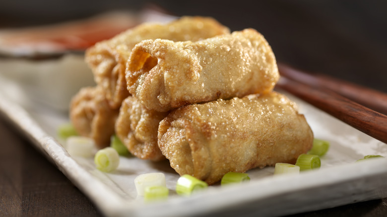 a plate of egg rolls