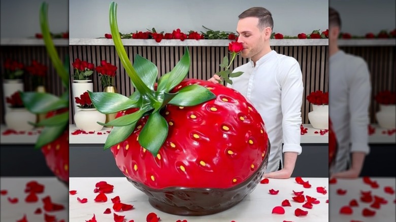 Amaury Guichon smiling on the red carpet for the movie Wonka