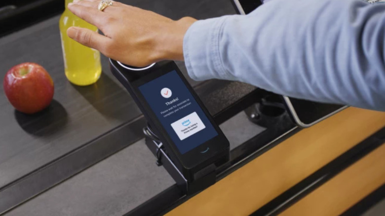 hand scanning at grocery checkout