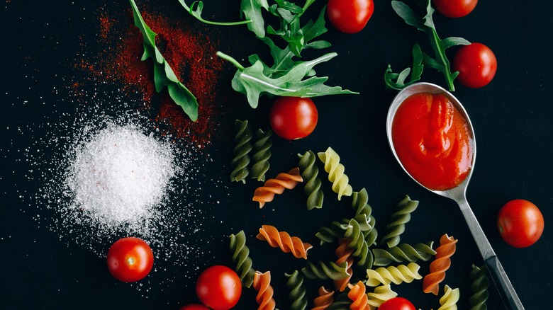 Tomatoes with sauce, rotini, salt