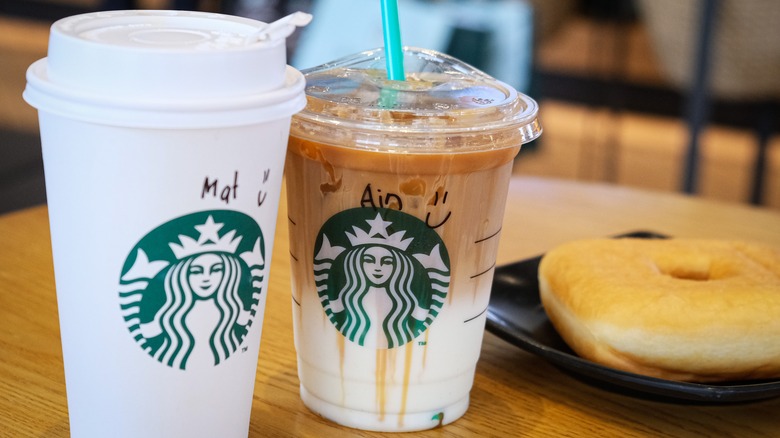 two starbucks drinks cup on table