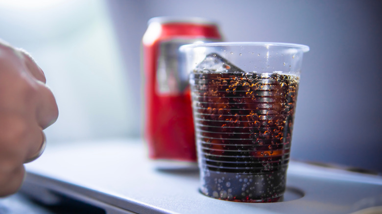 Why Your Airplane Soda Tastes A Bit Different Than Usual