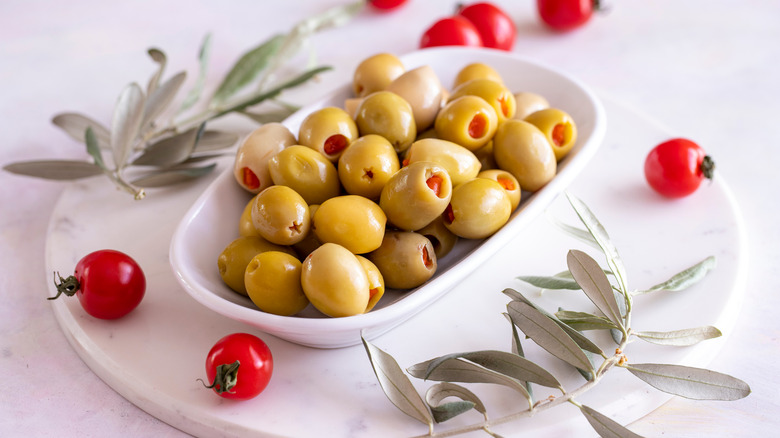Pimento-stuffed olives in white bowl