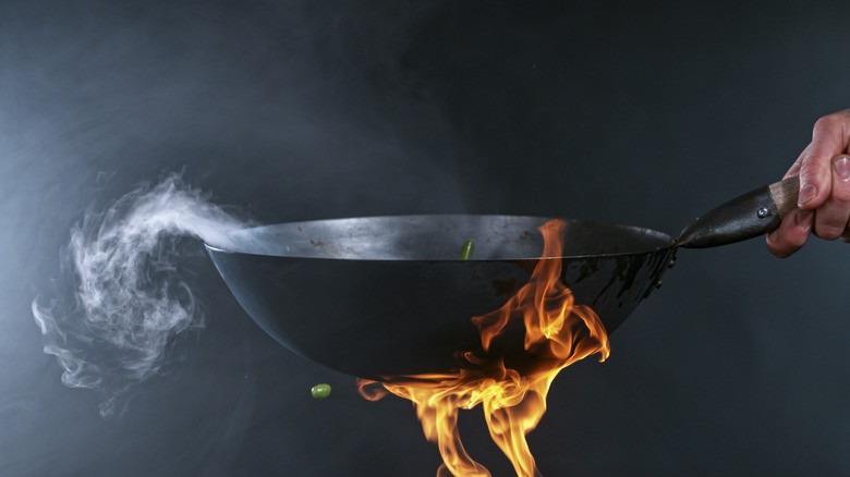 wok hand flame steam