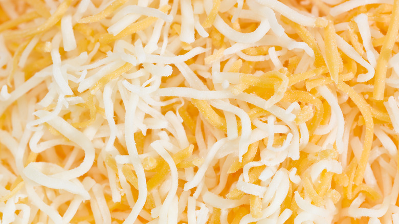 shredded orange and white cheese