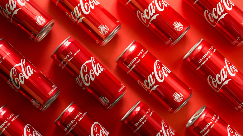 Rows of Coca Cola cans