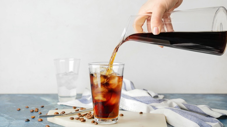Cold brew coffee being poured over ice