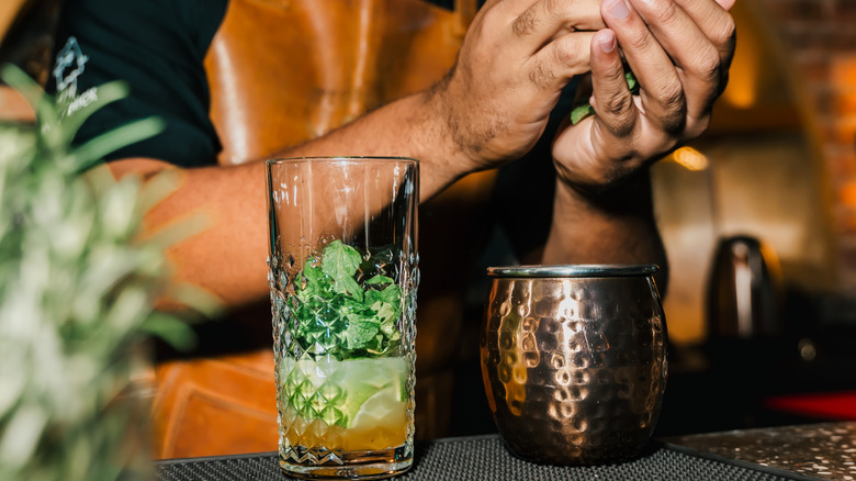 Bartender preparing cocktails at bar