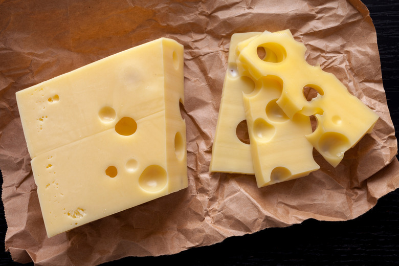 Why does Swiss cheese have holes?