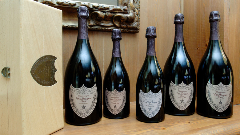 Five bottles of Dom Pérignon on a counter top