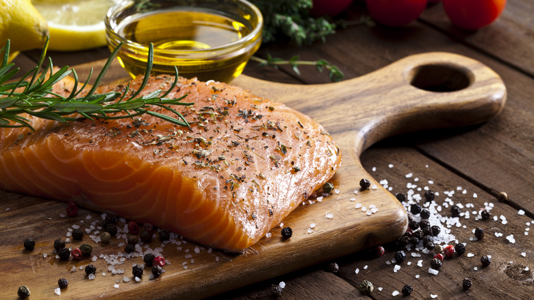 Salmon on wooden cutting board