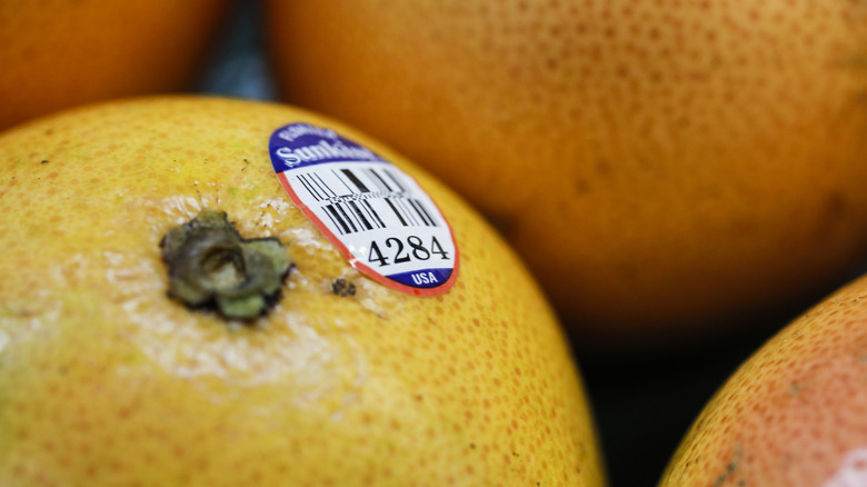 produce sticker on an orange