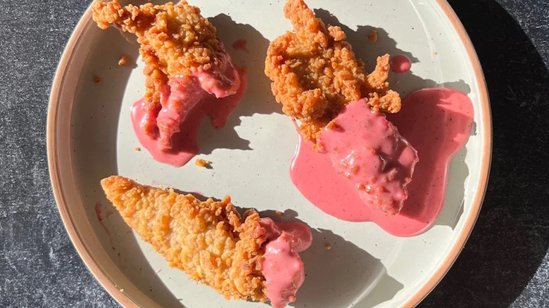 Chicken tenders dipped in Pink sauce