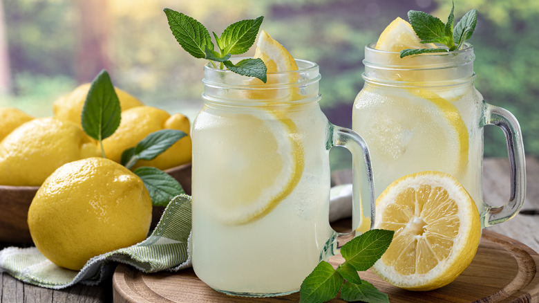 Glasses of lemonade with lemon slices and mint