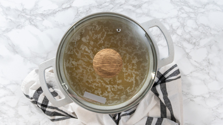 Elbow macaroni boiling in a pot of water