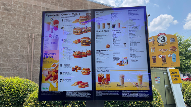 Computerized McDonald's drive-through menu with a drink menu, combo meals, happy meals, fan favorites, and other sections.