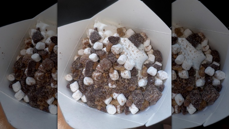 An unmixed McFlurry with chocolate and marshmallows in a paper container