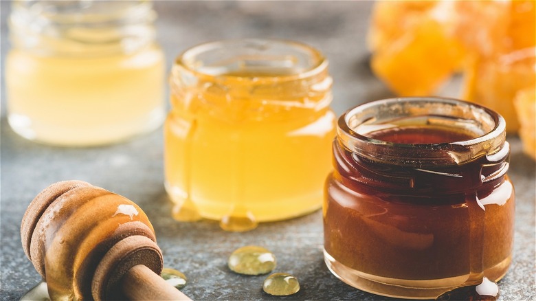 Glass jars of light and dark honey