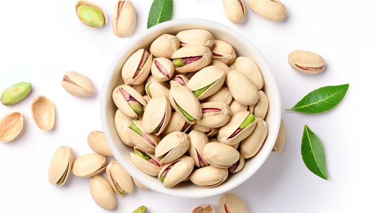 White bowl of in-shell pistachios