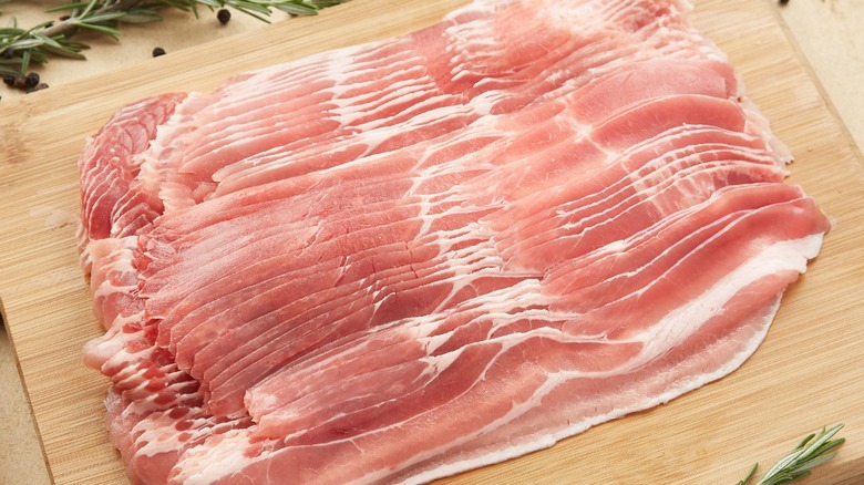 Bacon slices on cutting board