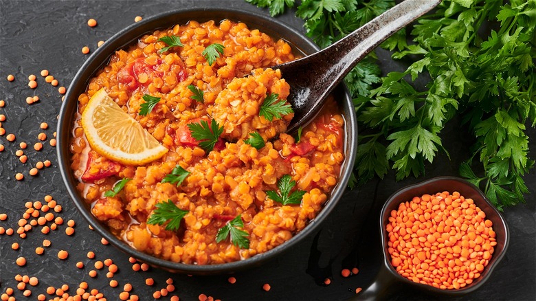 Cooked red lentils in bowl 