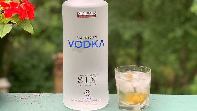 Bottle of Kirkland vodka with cocktail