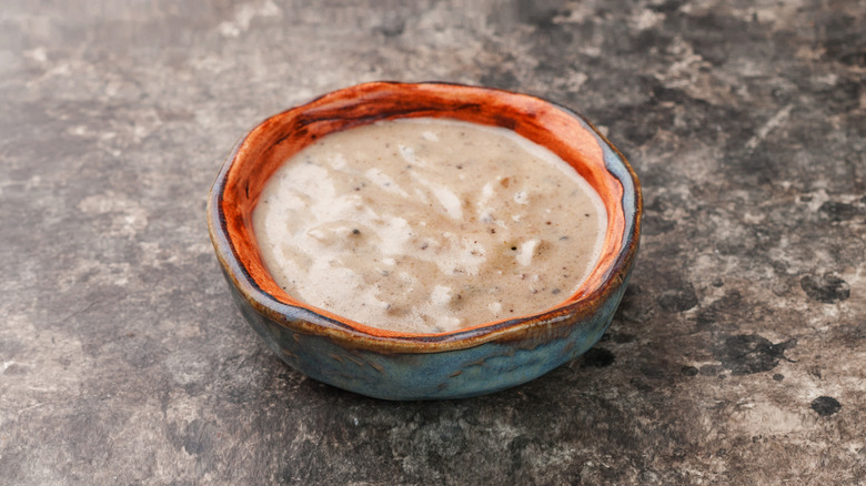 Homemade creamy dressing for coleslaw in small bowl