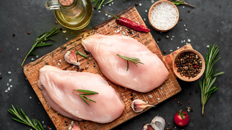 Raw chicken on cutting board
