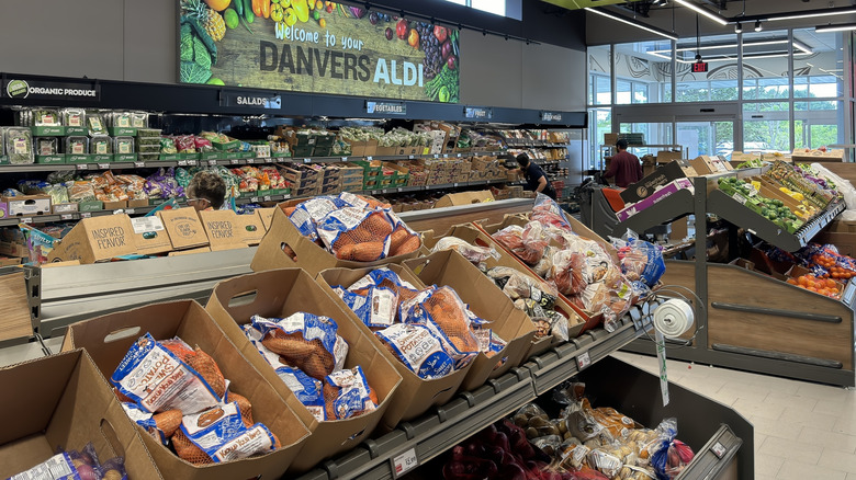 Various potatoes for sale at Aldi, all inside plastic bags or nets