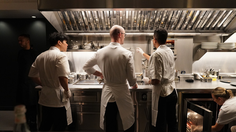 Cooks in the kitchen of One Michelin Star restaurant Frevo in Greenwich Village