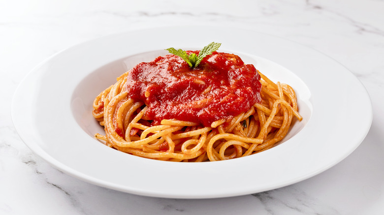 Pasta with tomato sauce and leaf