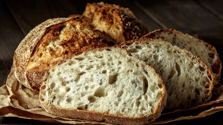 loaf of sourdough and slices of sourdough bread