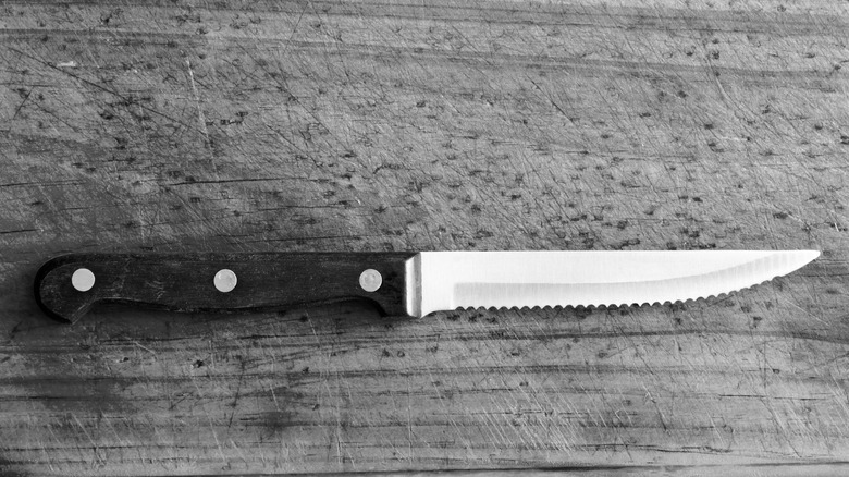 close up of serrated steak knife