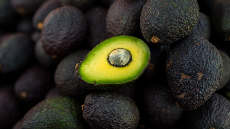 A pile of ripe avocados