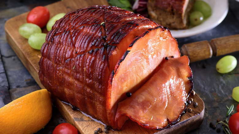 glazed ham on cutting board
